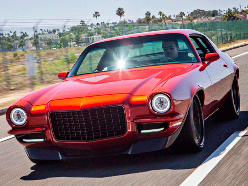 Camaro driving down the road